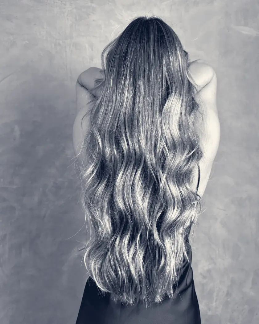 Long, glossy waves seen from behind