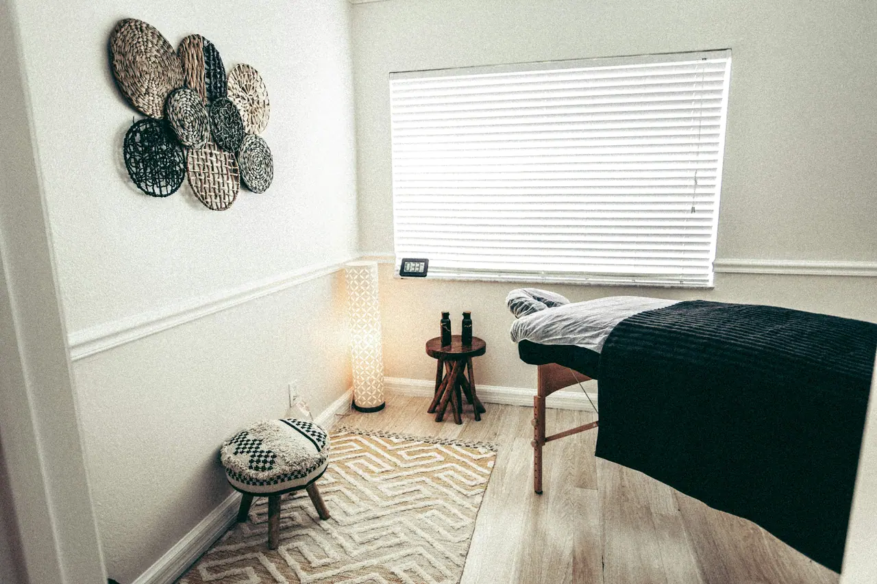 Calm treatment lounge with warm lighting and armchairs